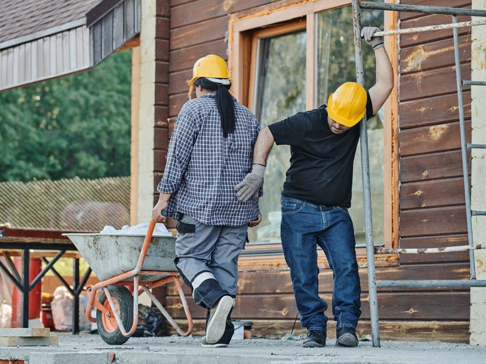 Crew working on a timber house exterior