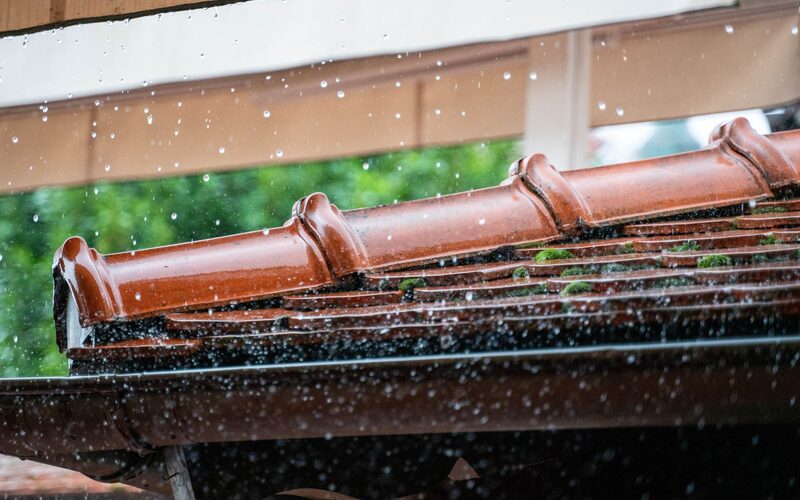 Rainwater running through a roof gutter