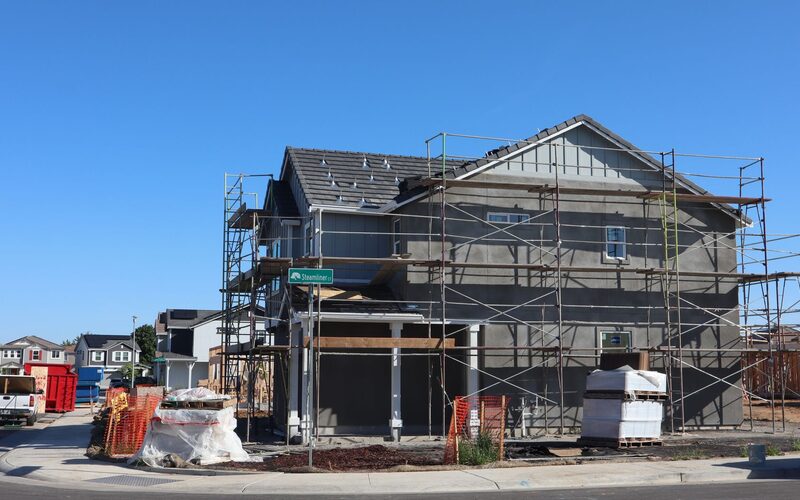 House under renovation with scaffolding